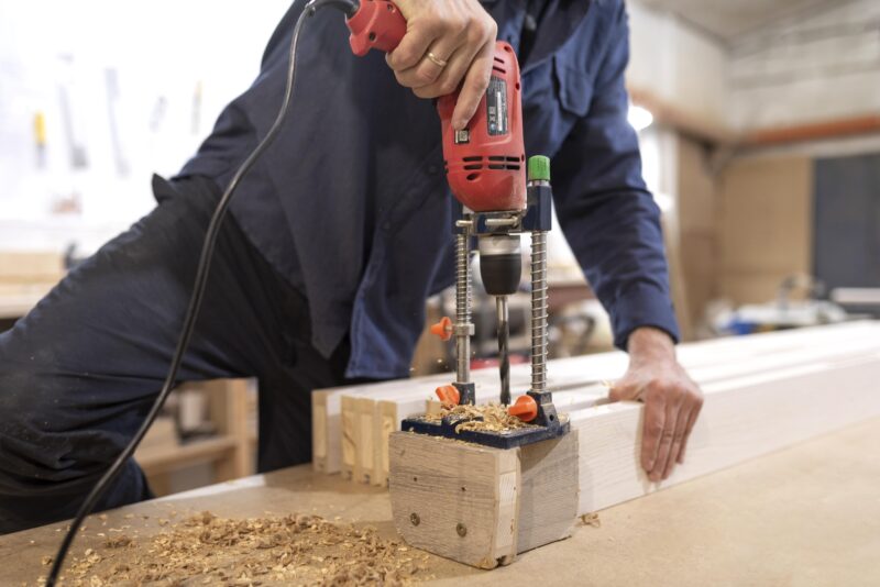 Creative man working woodshop